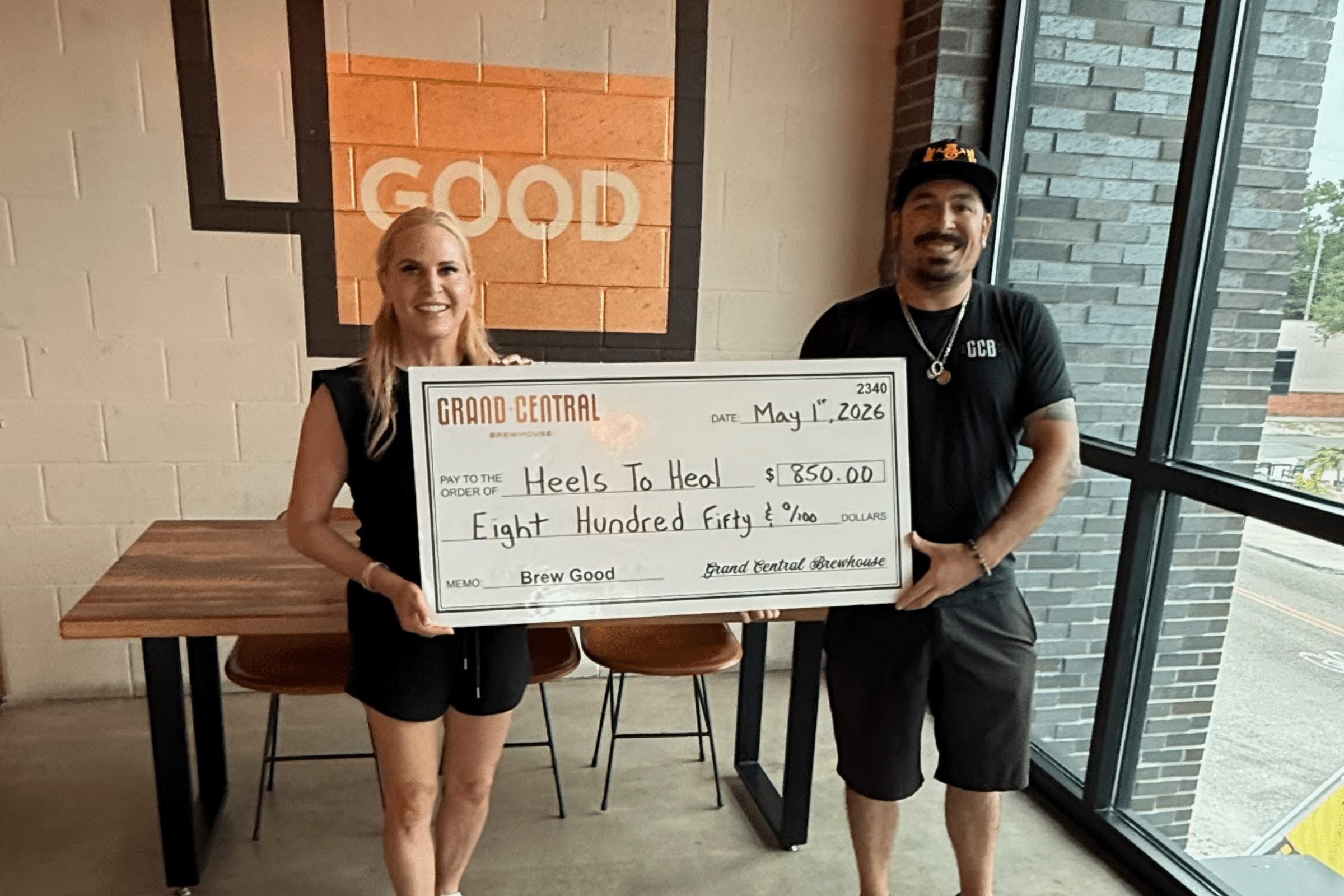 Heels to Heal Brew Good Partner Check Presentation
